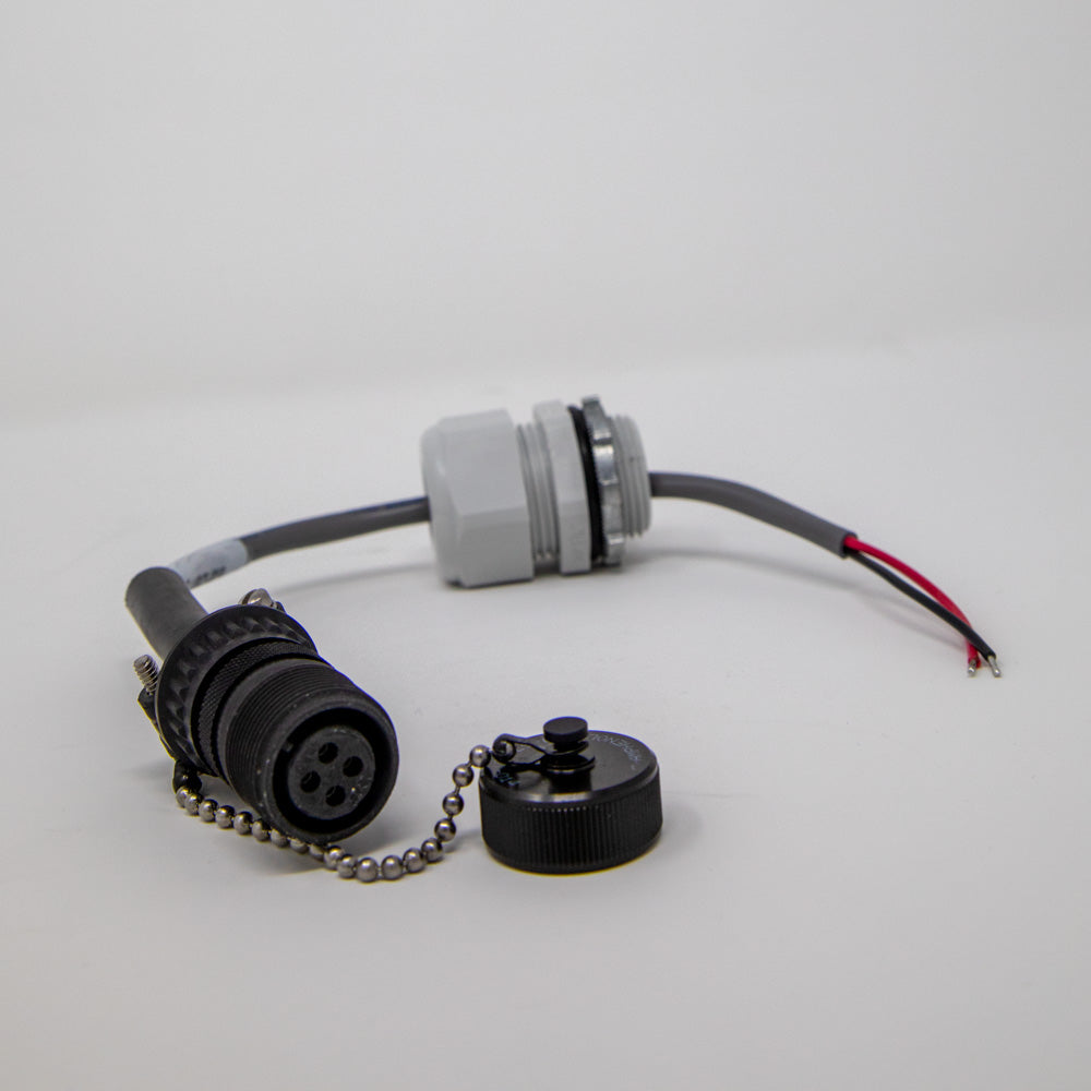 A close-up of a black cable with a connector, emphasizing the connection point against a simple backdrop.