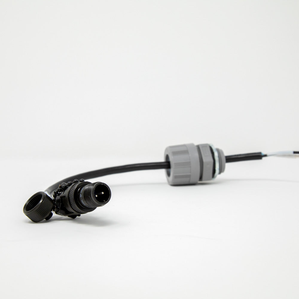 A close-up of a black cable with a connector, emphasizing the connection point against a simple backdrop.