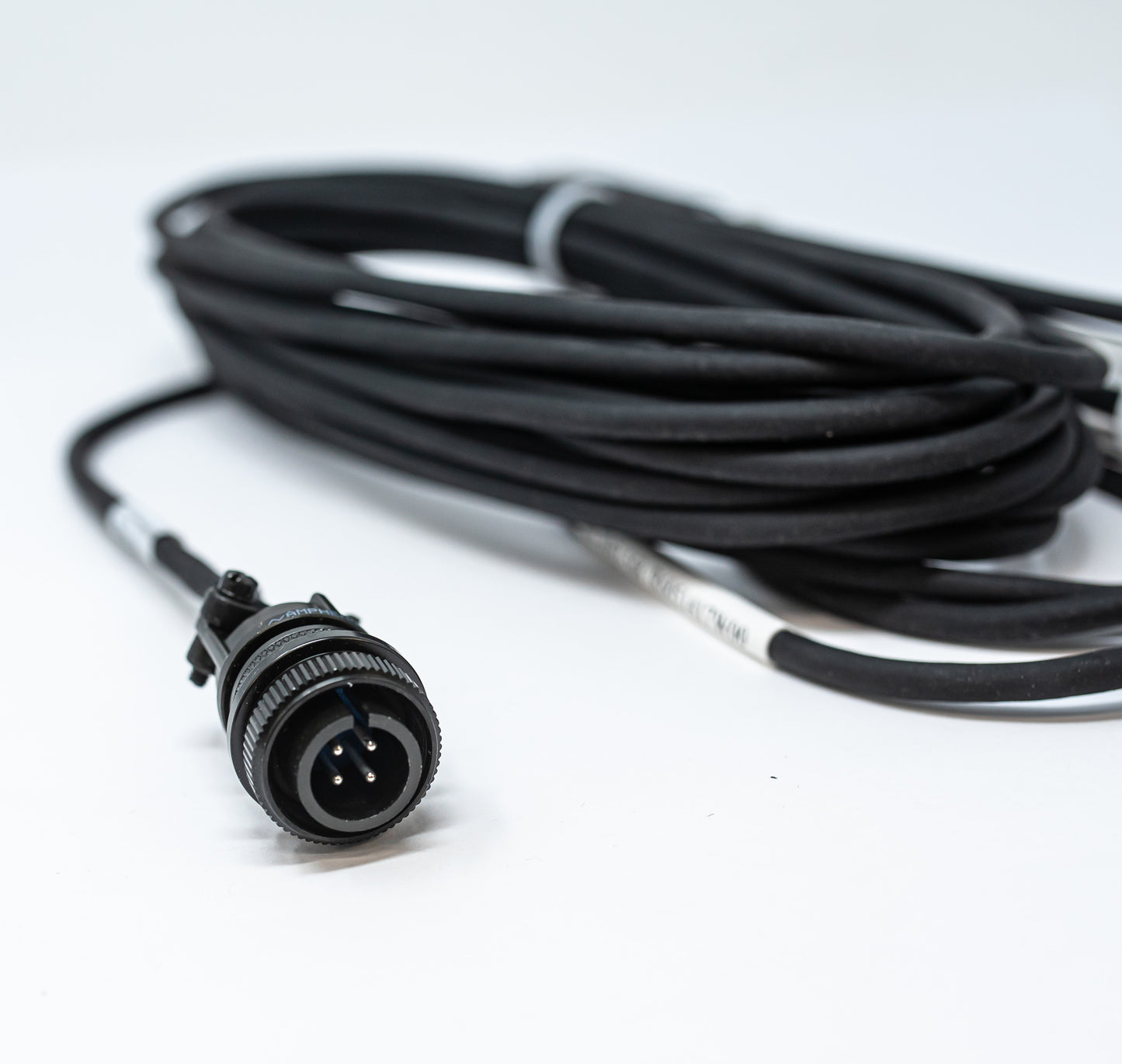 A black cable with a connector, illustrating a modern and elegant aesthetic.