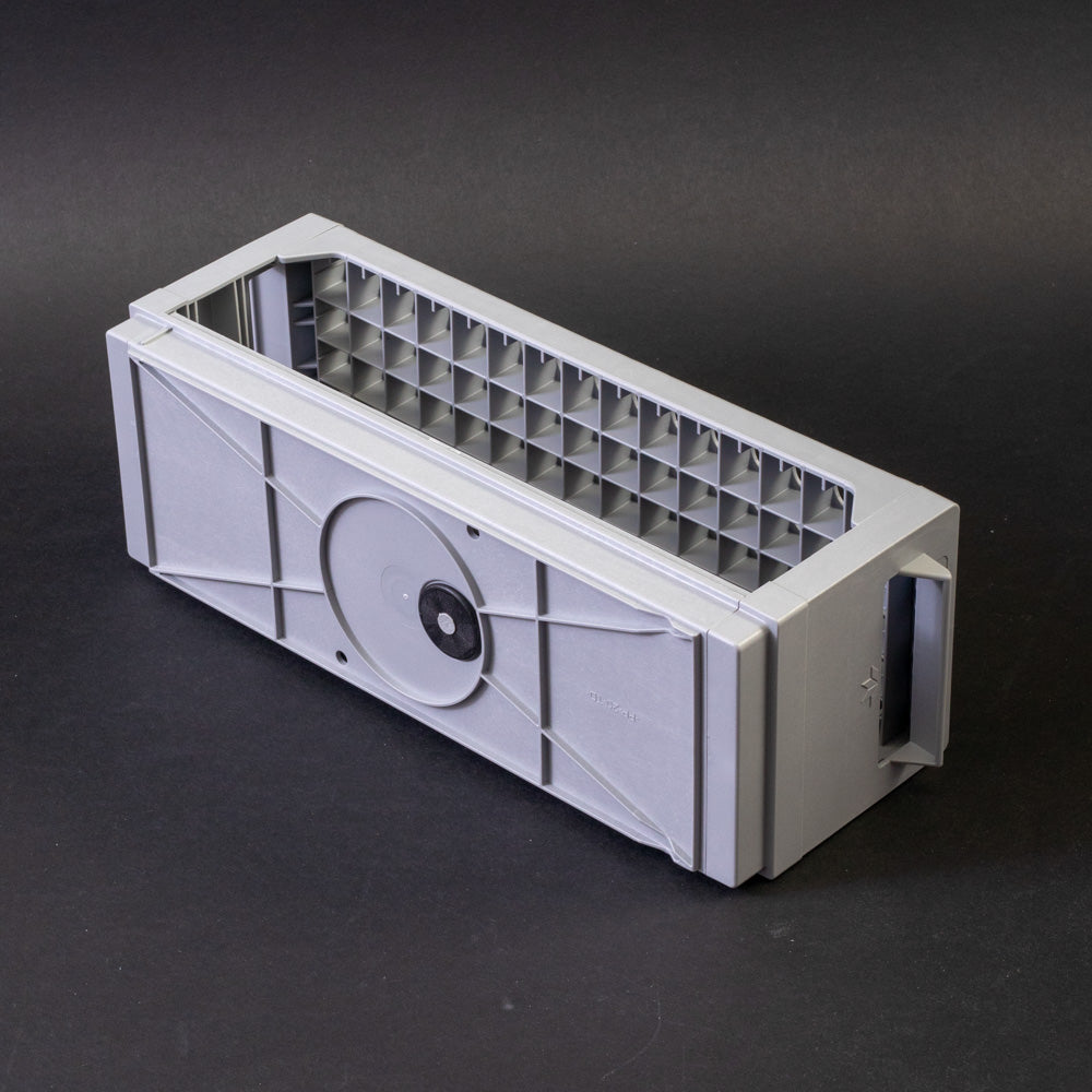 Gray plastic shelf with perforated design, allowing for location and storage of vials.