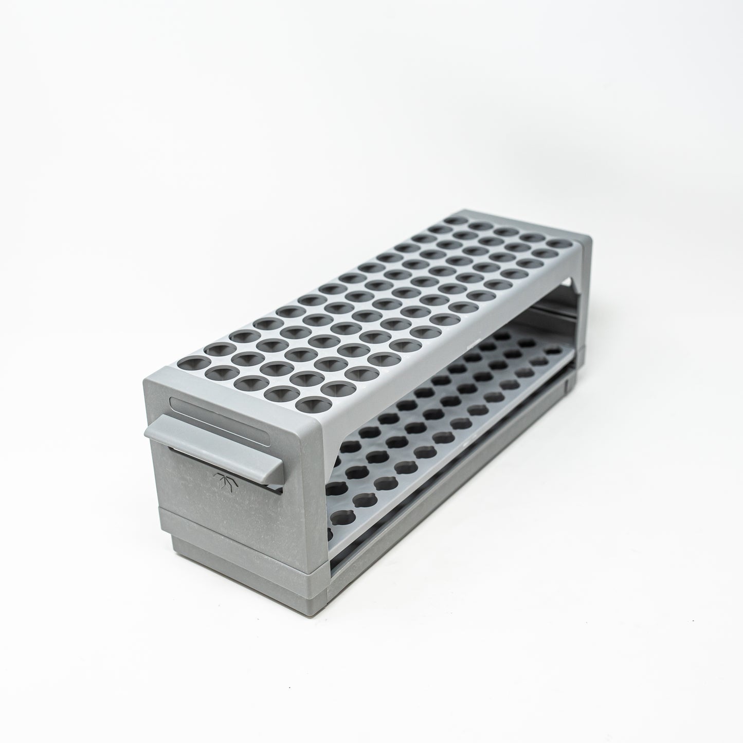 A rectangular shaped gray plastic box featuring multiple holes on its top, designed for test tube location and storage purposes.