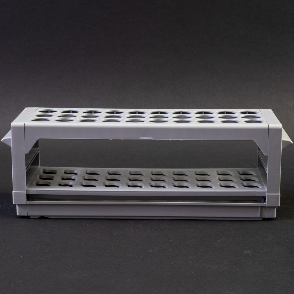 Gray plastic shelf with perforated design, allowing for location and storage of vials.