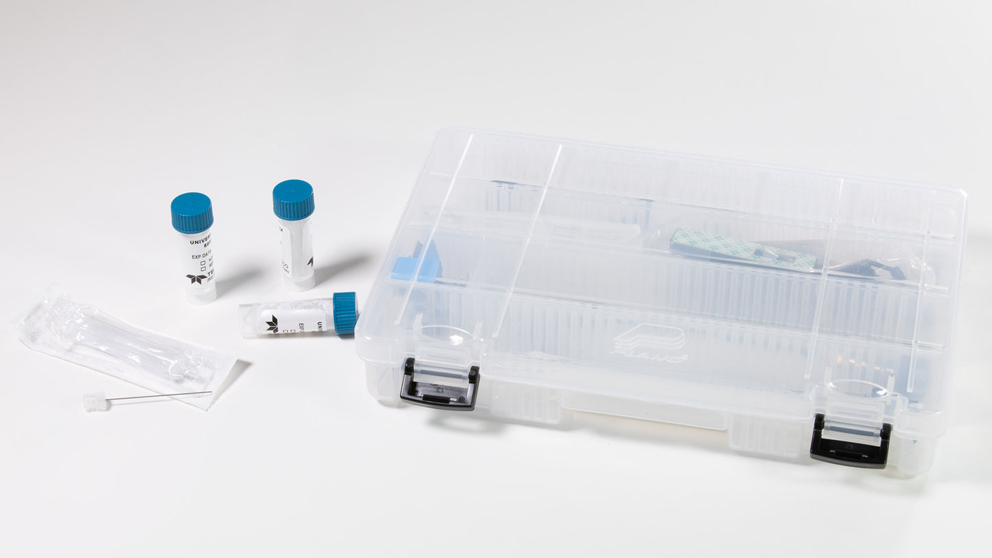 A plastic case showcasing a syringe, tube, and other medical items, all arranged for efficient storage and use.