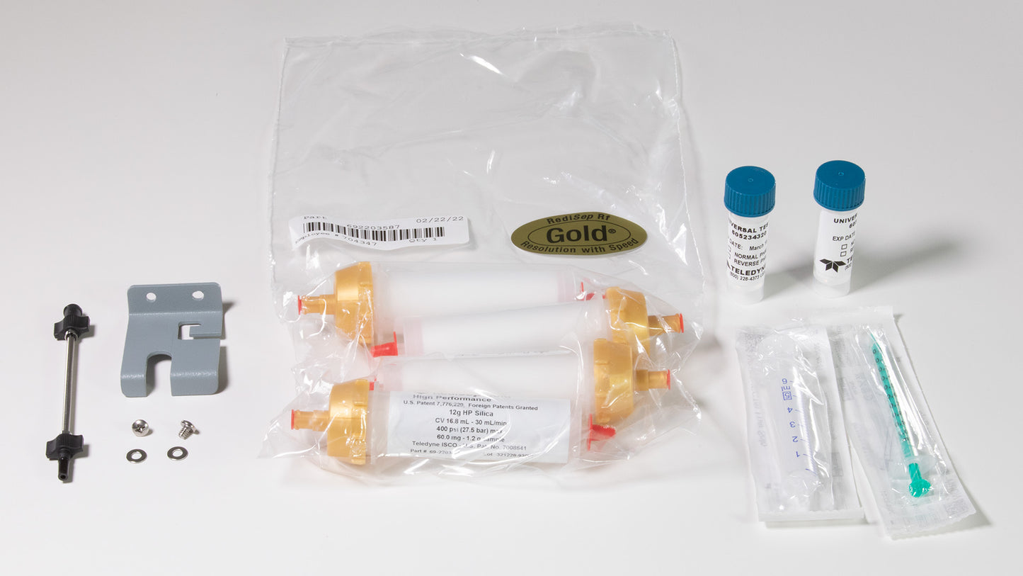 A kit featuring a syringe, chromatography columns, and various essential items for laboratory use.