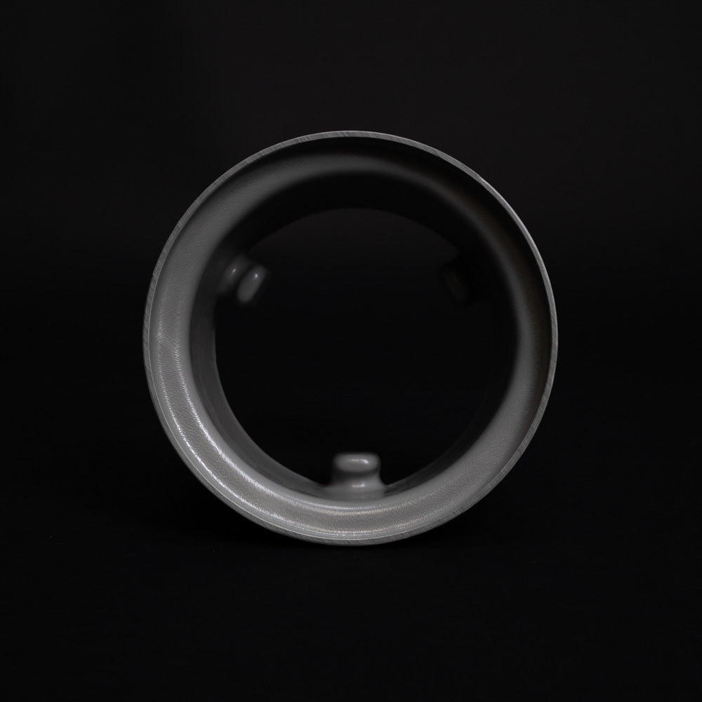 Detailed close-up of a round plastic object, highlighting its elegant design and fine craftsmanship.