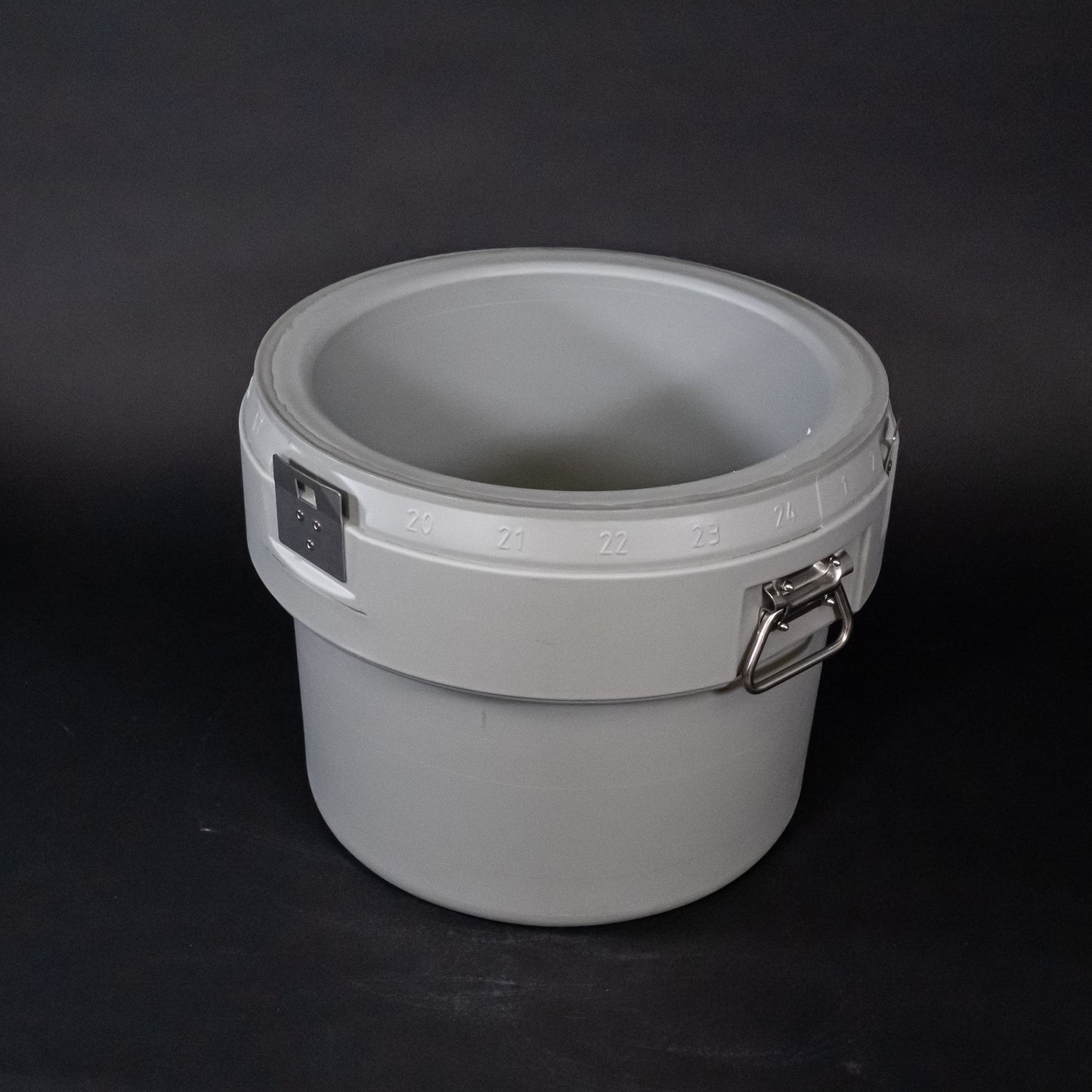 A gray plastic container, suitable for storage and organization purposes.