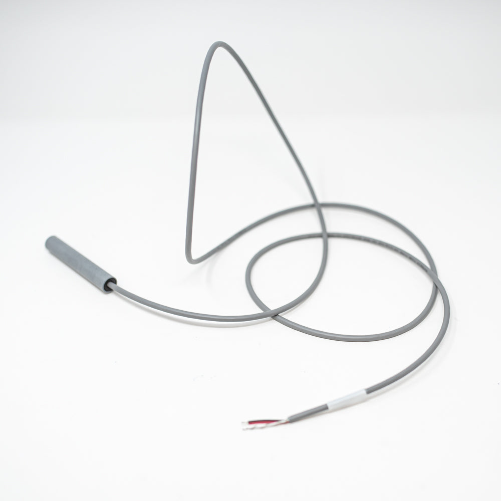 A close-up of a wire with a sensor attached, highlighting its functionality and structure.