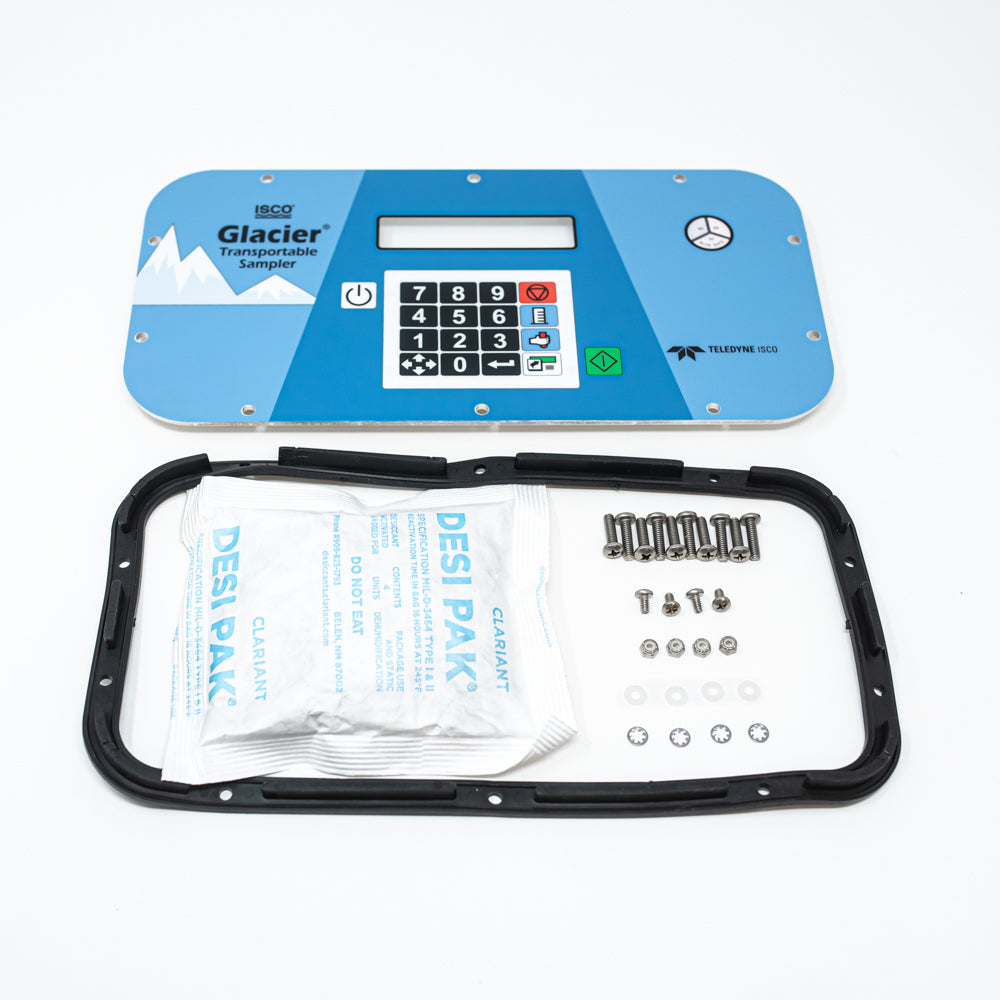A blue electronic keypad and display device, accompanied by a bag of desiccant and mounting screws, showcasing a modern and portable design.