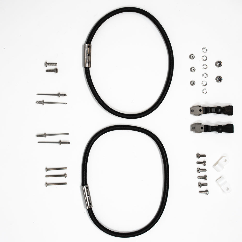 A set of black rubber straps alongside screws, positioned on a white surface.