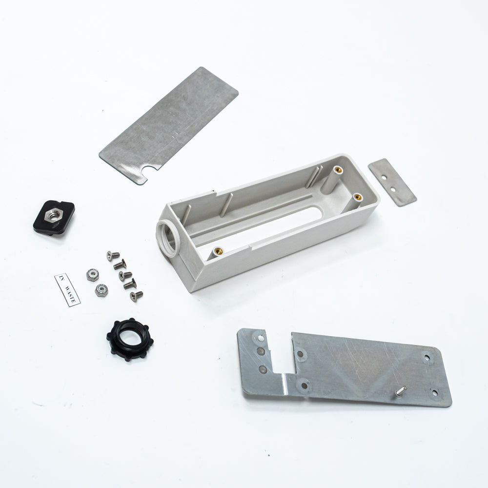 A clean white background featuring a collection of various mechanical components and screws organized for easy access.