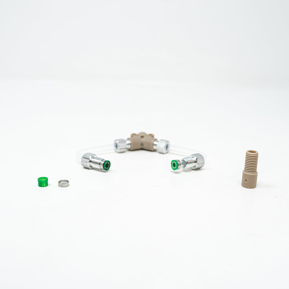 A collection of tubing nuts and ferrules positioned against a clean white background, showcasing its vibrant colors and design.