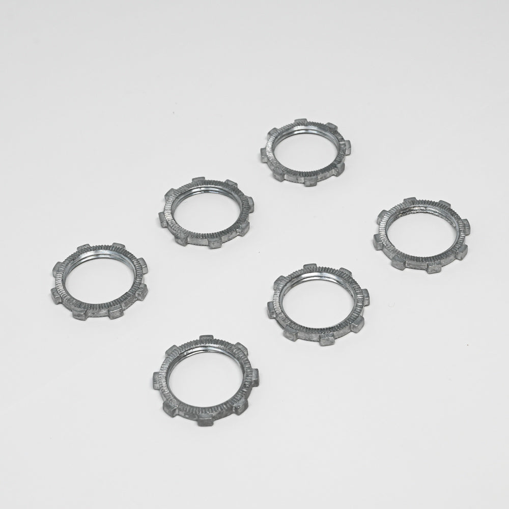 A set of shiny silver metal rings, elegantly positioned to emphasize their smooth and polished appearance.