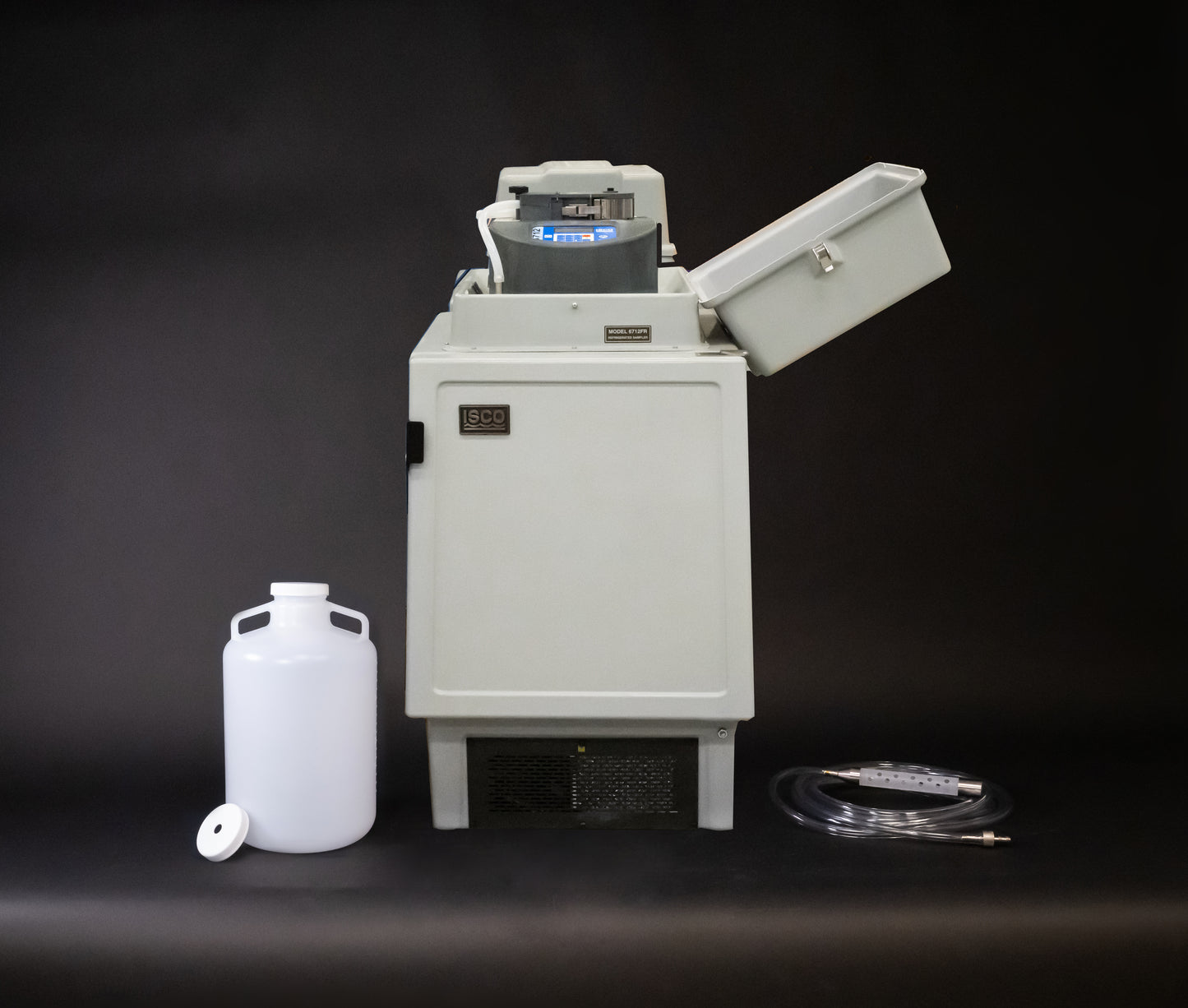 A refrigerated sampler featuring a hose and a bottle, designed for efficient operation in various tasks.