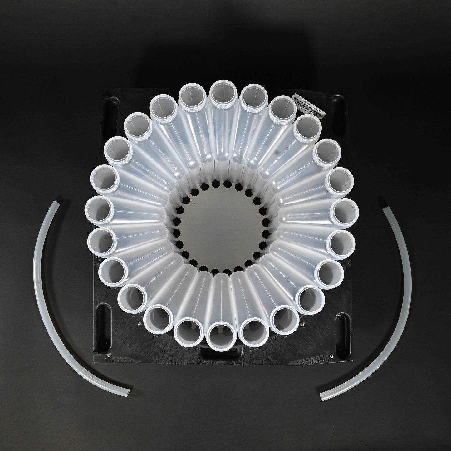 24 polypropylene bottles with caps, bottle rack and two discharge tubes.