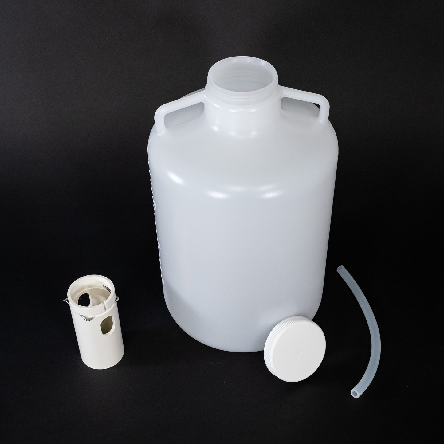 A white plastic container with a matching lid and a white plastic hose attached, set against a neutral background.