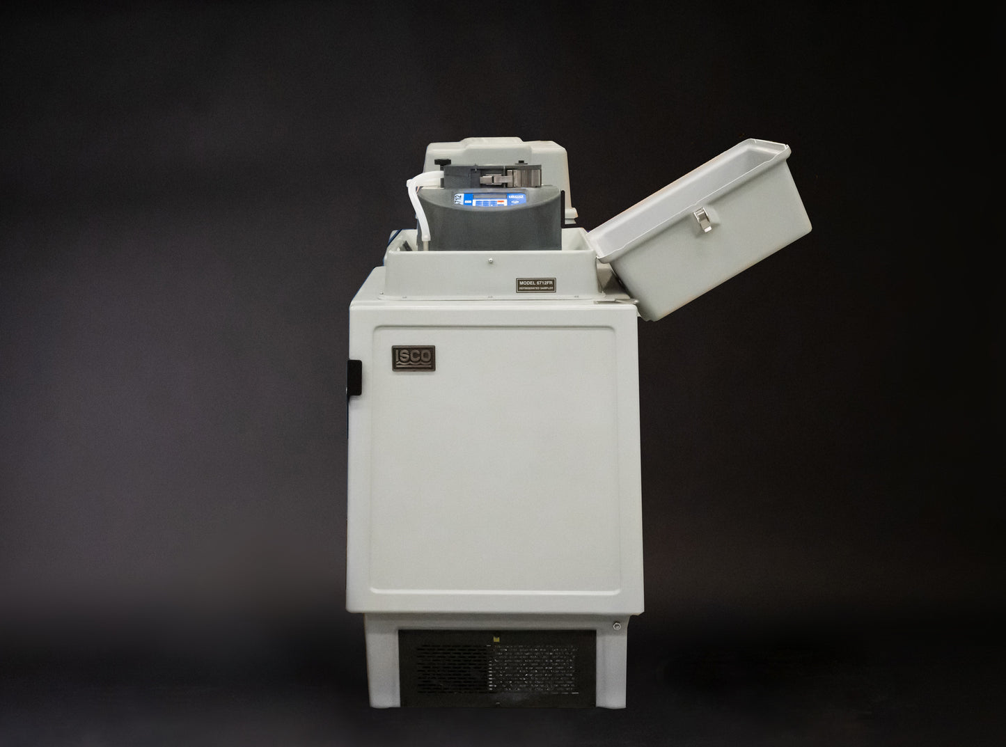 A refrigerated sampling device featuring a prominent controller, designed for various functional applications.