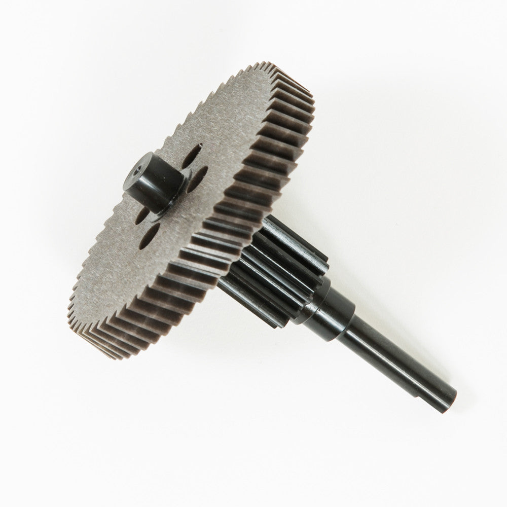 A gear positioned on a white background, characterized by a black center and detailed teeth around its circumference.