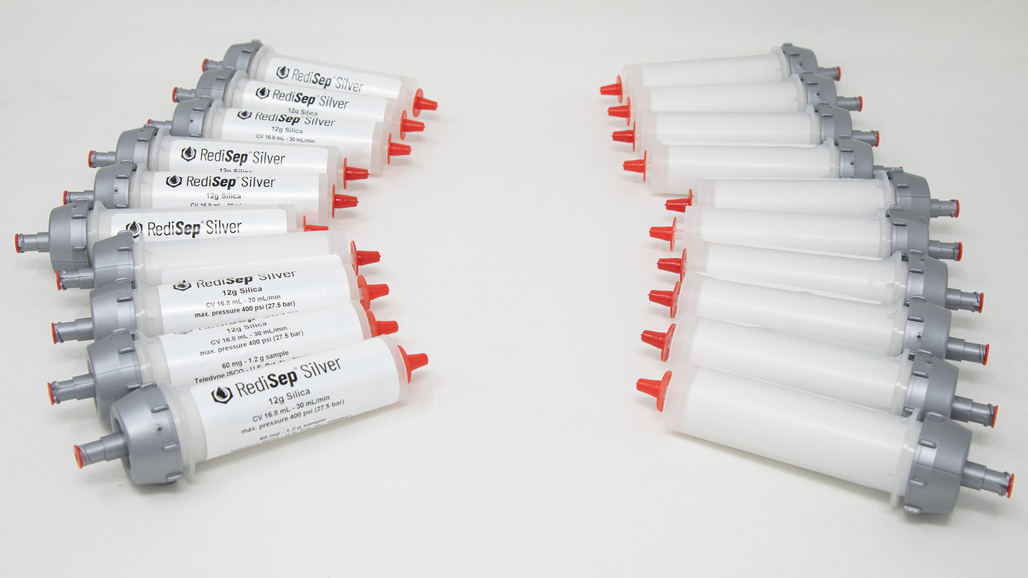 A group of plastic tubes with red and silver caps, positioned side by side, emphasizing their contrasting colors and forms.