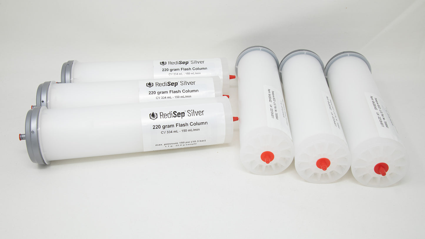 A group of plastic tubes with red and silver caps, positioned side by side, emphasizing their contrasting colors and forms.