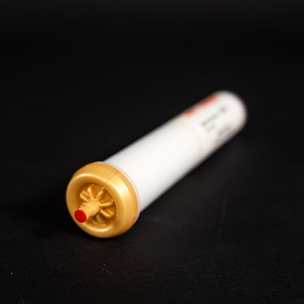 A tube characterized by gold and red caps, emphasizing functionality and ease of use.
