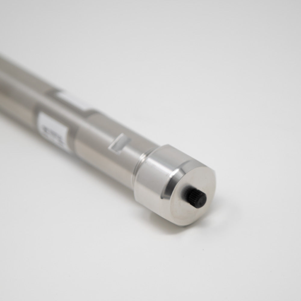 A stainless steel cylinder stands prominently against a clean white background, showcasing its sleek and reflective surface.