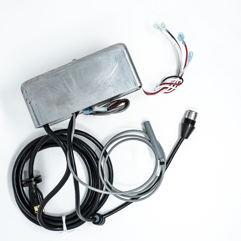 A power supply unit and various wires arranged neatly on a clean white surface.