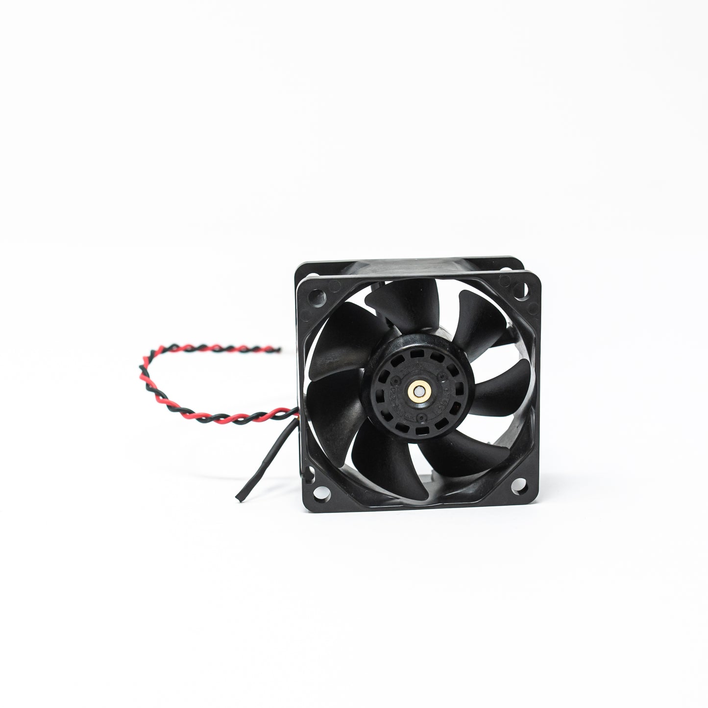 A black fan with visible wires set against a clean white background, highlighting its design and functionality.
