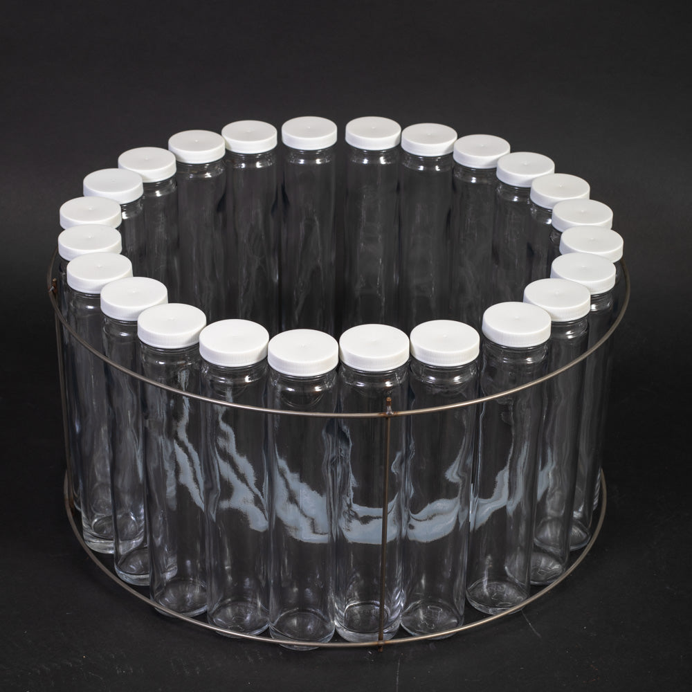 A circular formation of glass bottles with caps, evenly spaced, highlighting their transparent surfaces and uniform shape.