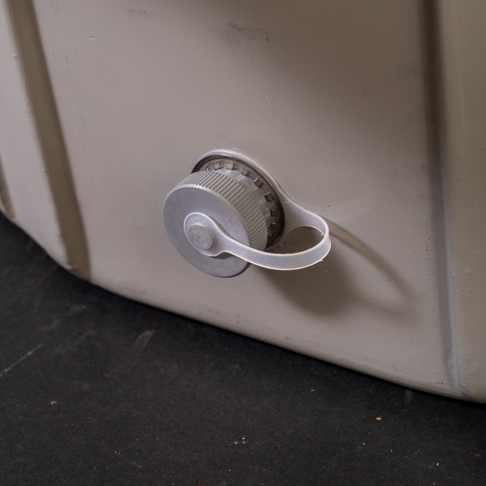 A close-up of a cap on drain attached to a sampler base, showcasing its simple design and functionality.