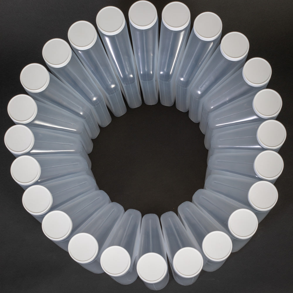 A circular formation of wedge shaped plastic bottles with caps, evenly spaced, highlighting their transparent surfaces and uniform shape.
