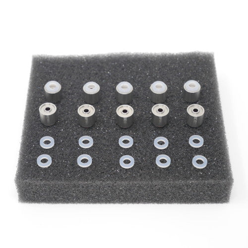 A set of cylindrical shaped stainless steel objects with plastic rings displayed on a piece of grey foam.