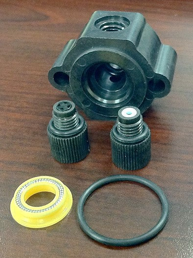 Various items used in the self-flush assembly pictured on a brown background.