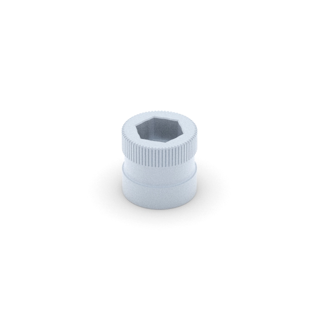 A white plastic nut resting on a smooth white surface, showcasing its simple design and color uniformity.