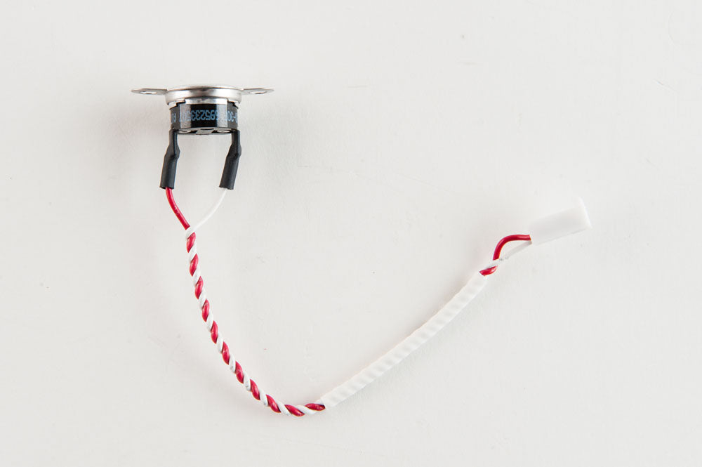 A cylindrical shaped switch with red and white wires attached, representing a straightforward electrical connection.