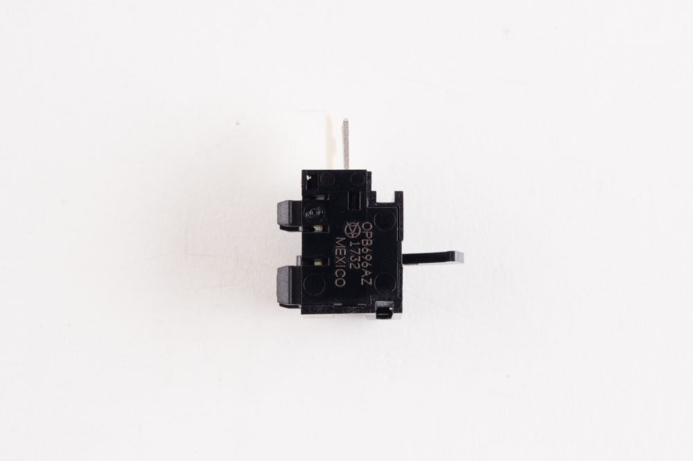 A compact black switch located on a plain white background.