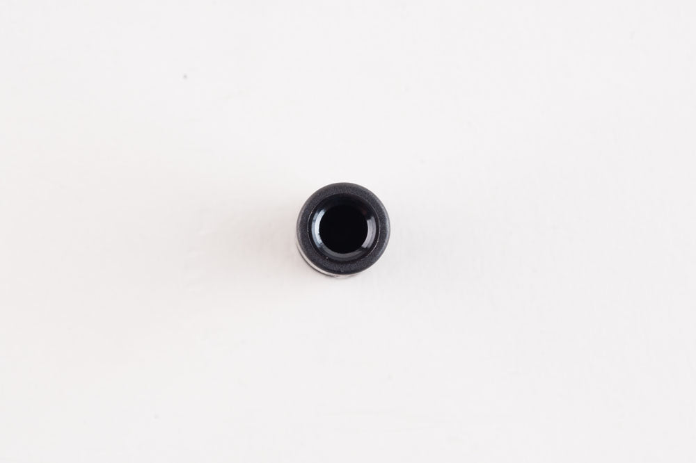 A black threaded union displayed on a white background, emphasizing its cylindrical shape and metallic finish.