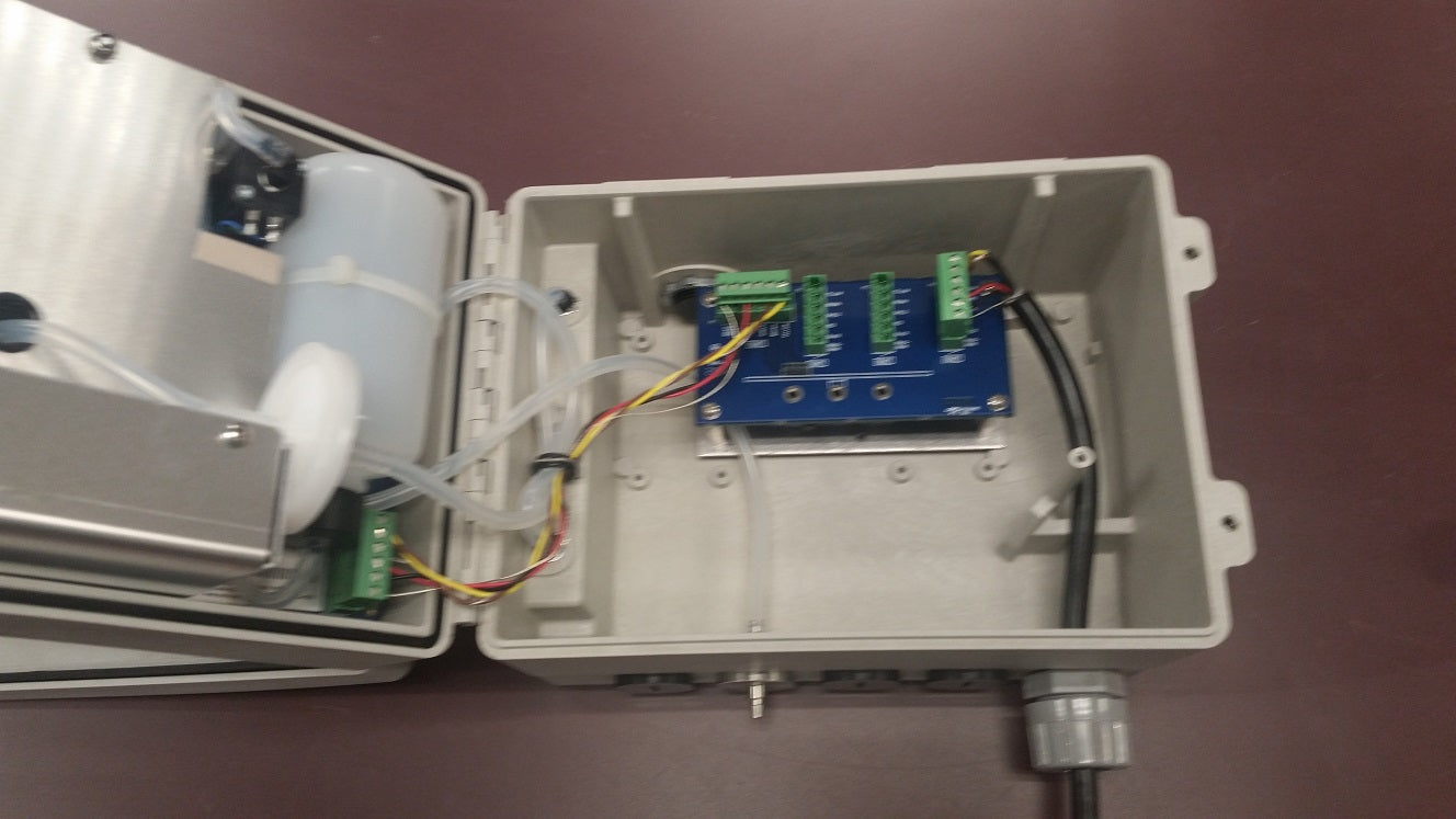 A small electronic device featuring wires and a power supply, designed for various technical applications.