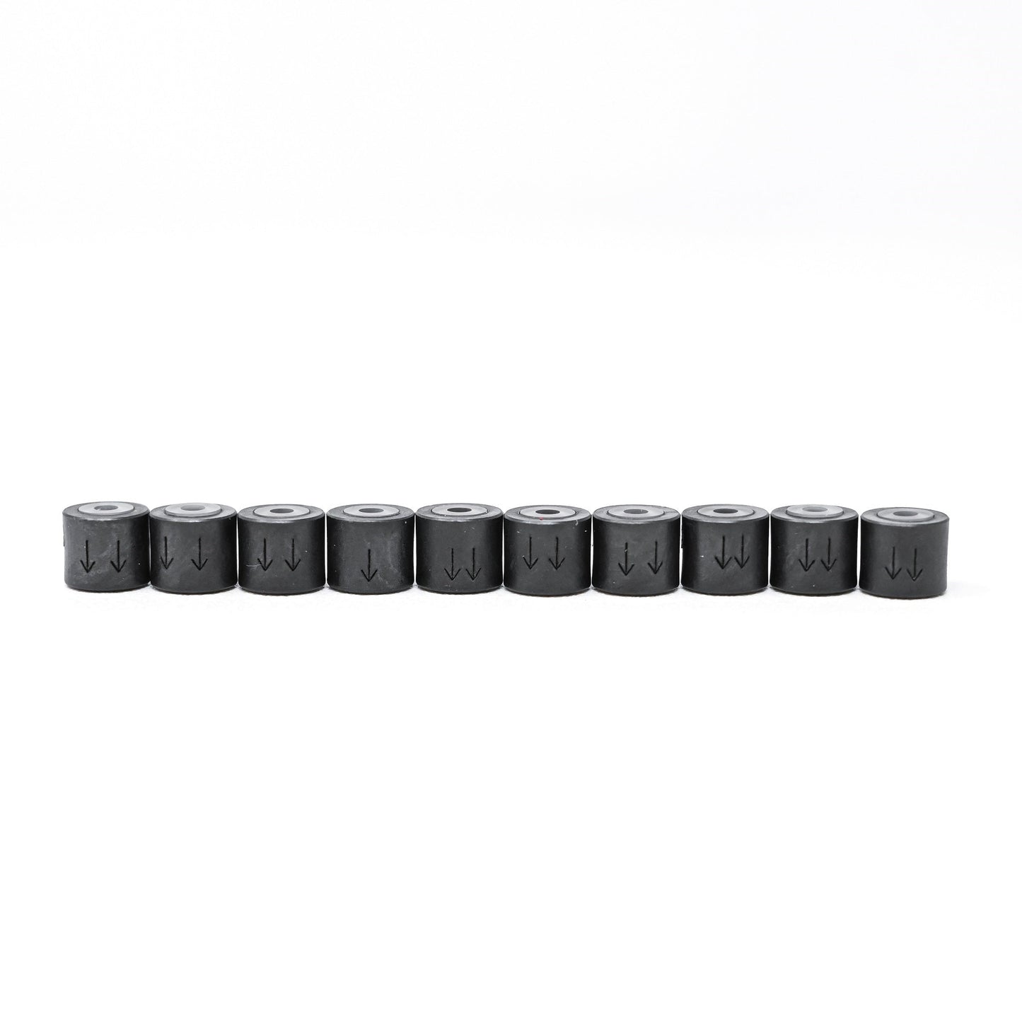 A set of cylindrical shaped check valves featuring silver bodies and a set of plastic rings.