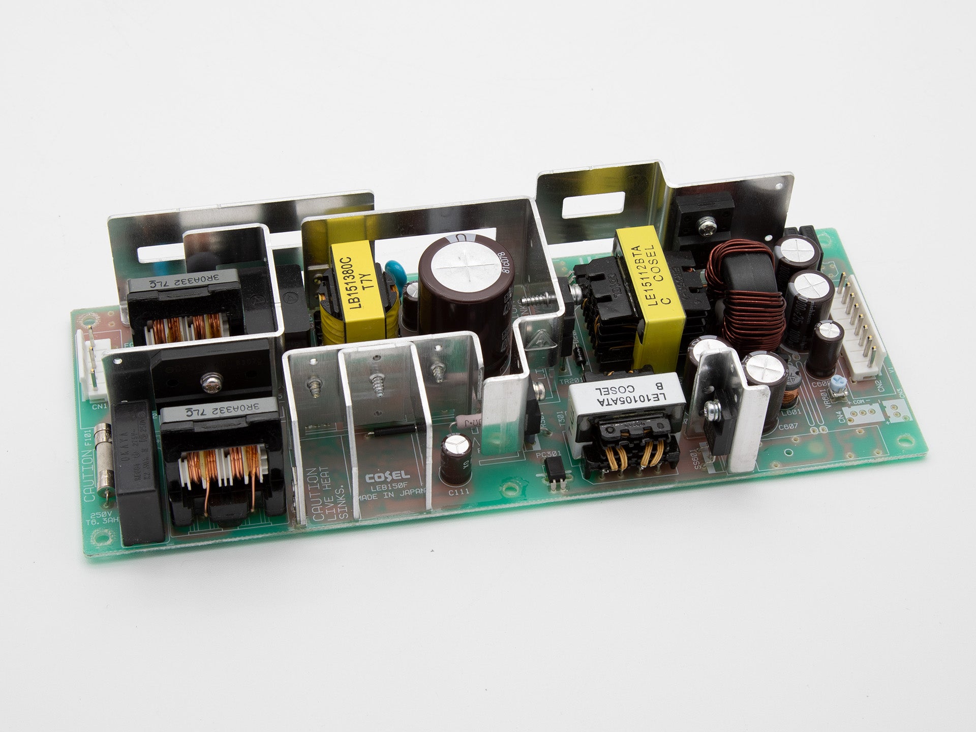 A power supply board positioned on a white background, showcasing its intricate circuitry and layout.