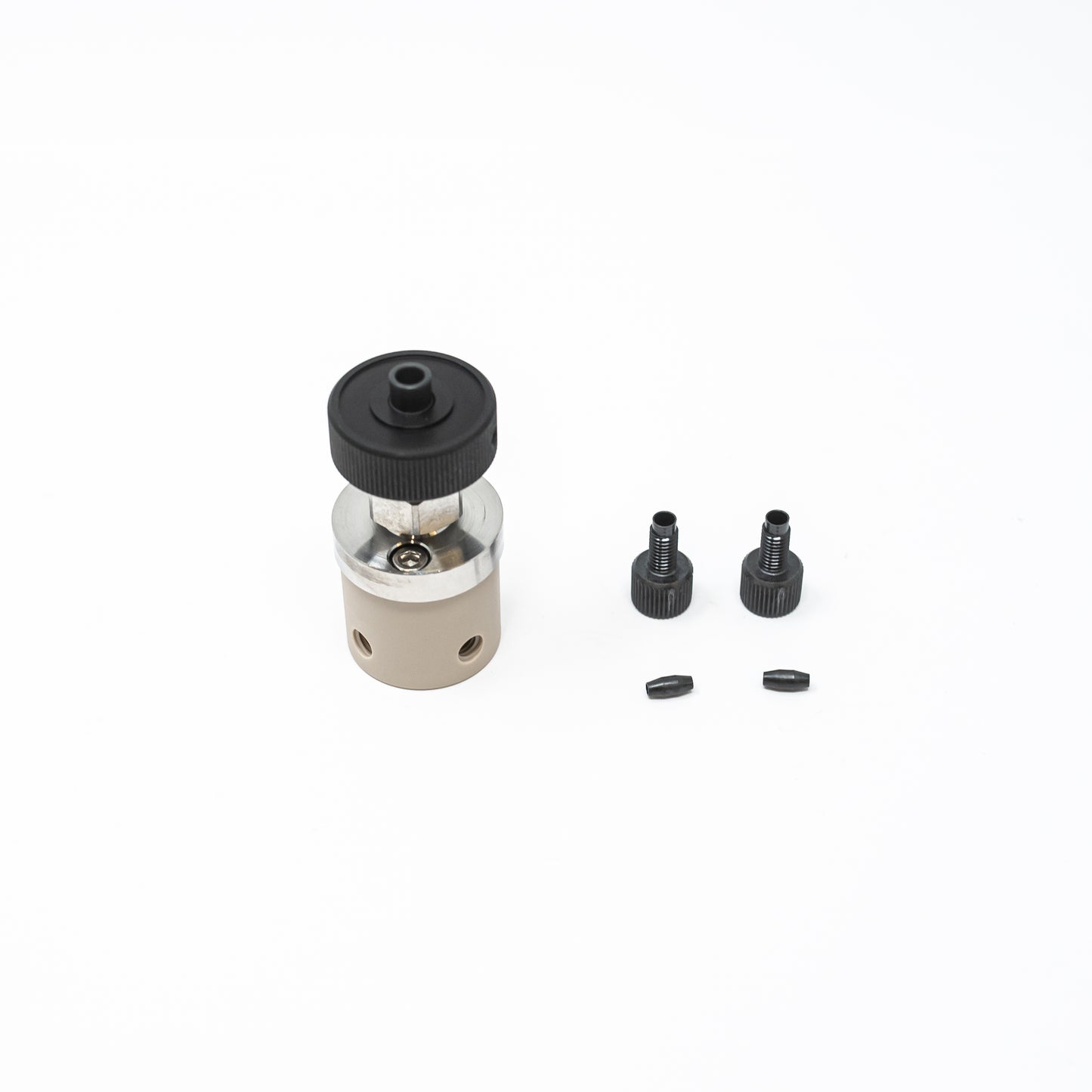 Small valve in black and silver, equipped with a black plastic cap, ideal for efficient control in fluid systems.