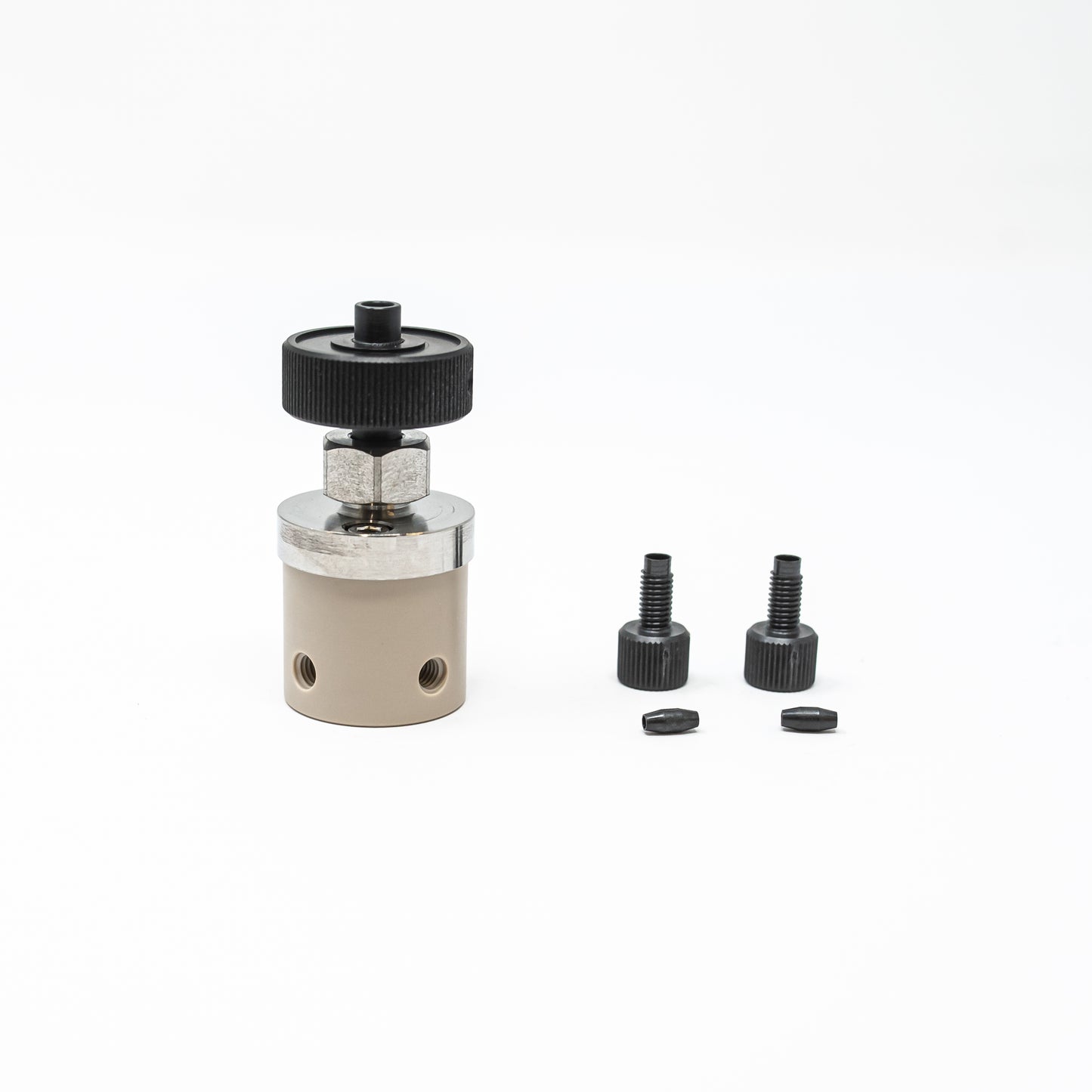 Small valve in black and silver, equipped with a black plastic cap, ideal for efficient control in fluid systems.