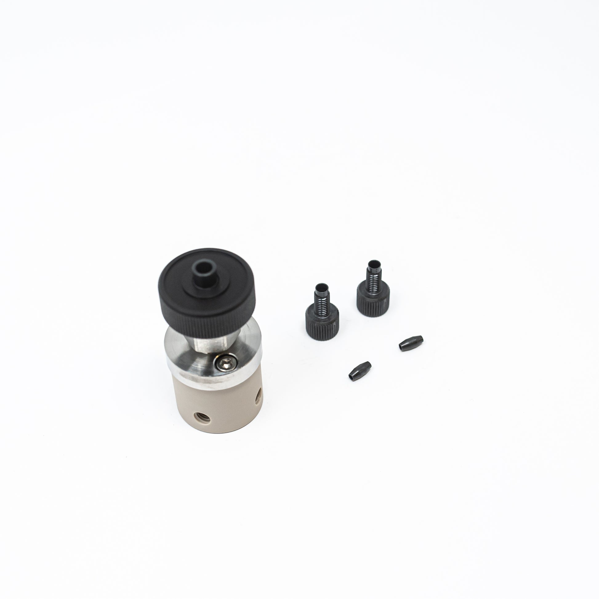 Small valve in black and silver, equipped with a black plastic cap, ideal for efficient control in fluid systems.