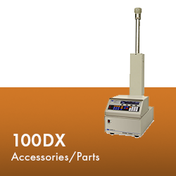 A machine displaying the text "100dx accessories / parts" prominently on its surface, indicating its function and purpose.