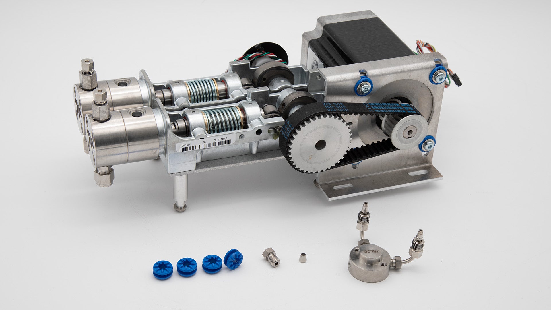 A miniature machine with pumps and several components, illustrating its compact structure and engineering precision.