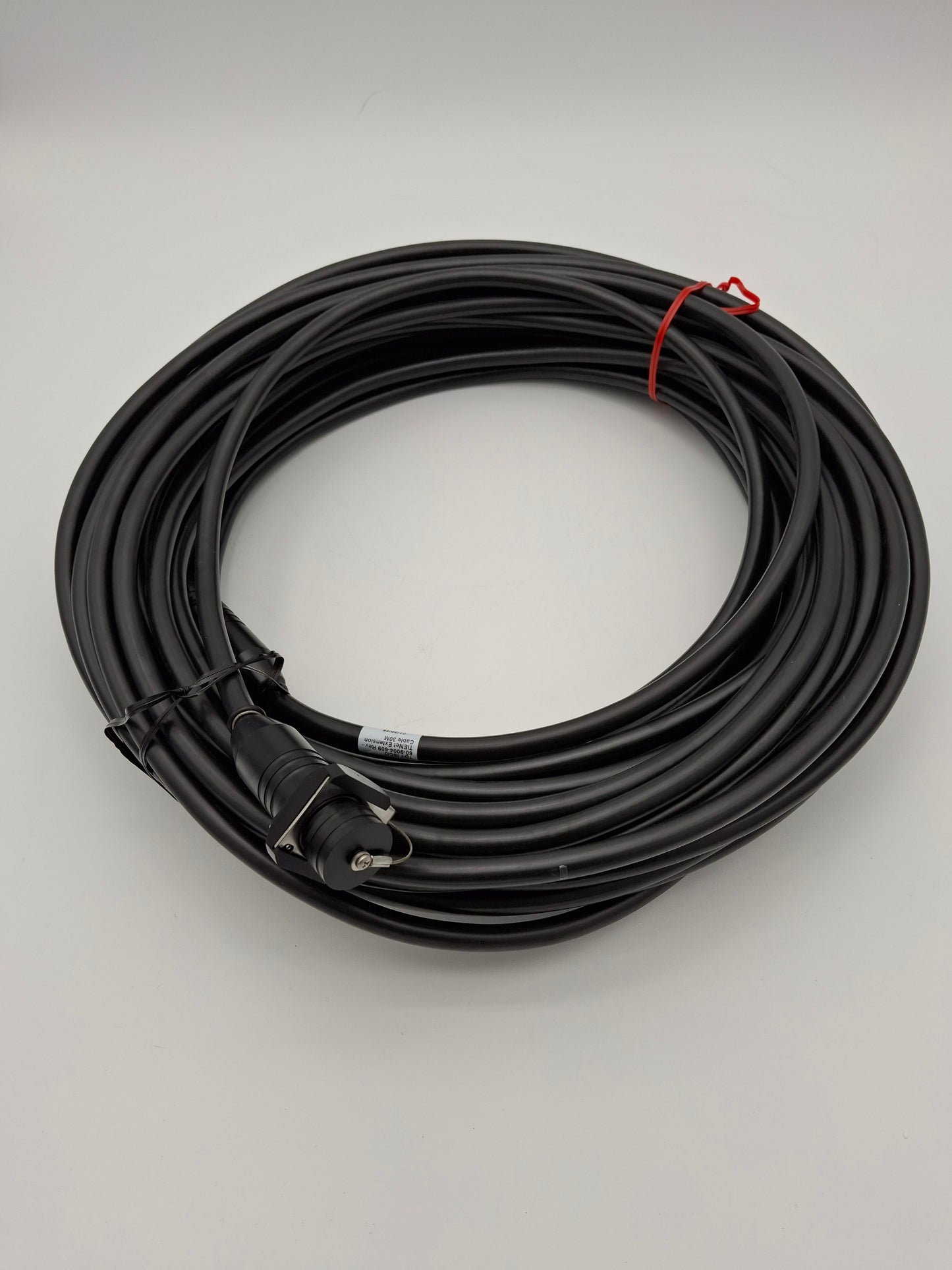 A black cable with connectors, showcasing a striking contrast in color and design.