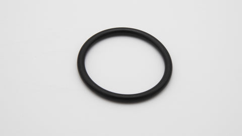 A black round object on a white surface