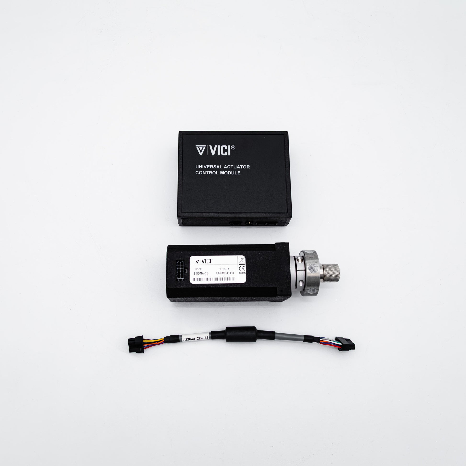 Vici universal actuator control module kit on a white background, including the black control module box, the main electronic module with a metal connector, and a wiring harness.