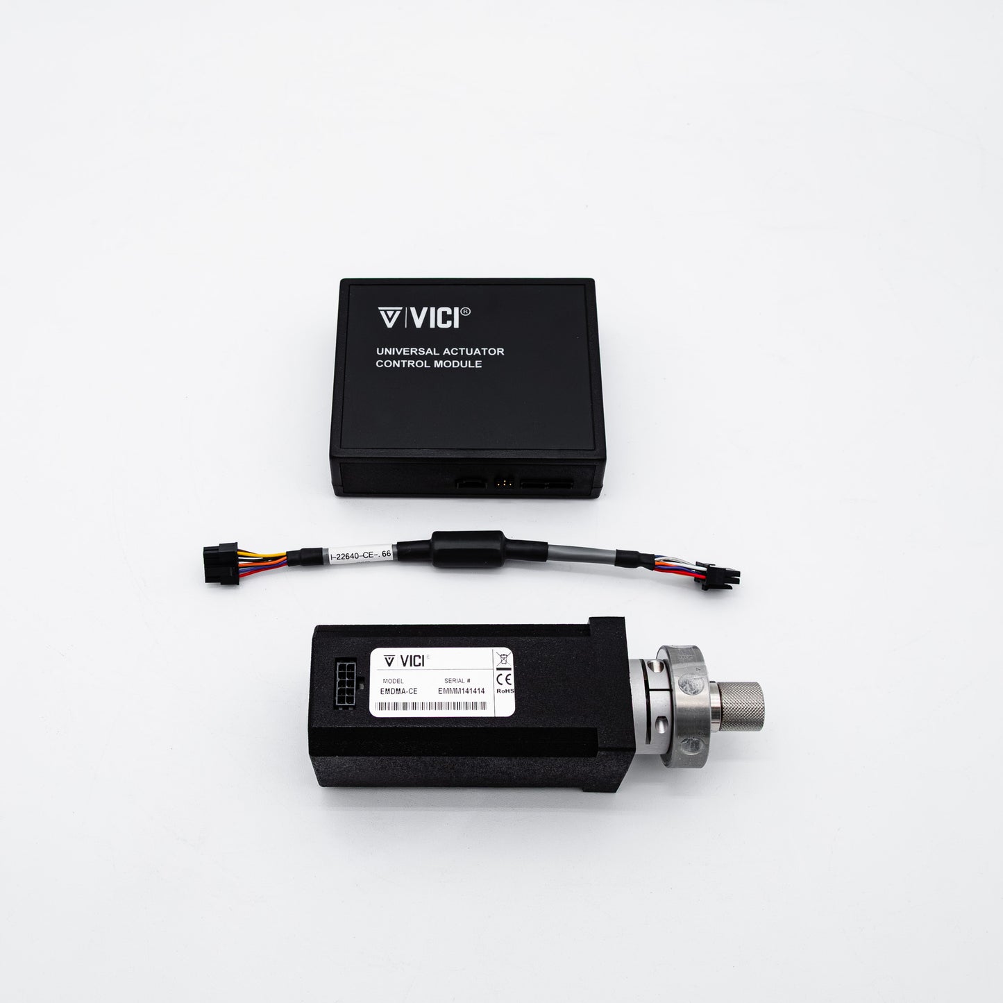 VICI universal positioning control module kit, featuring a black rectangular electronic module with a white label and a silver connector, alongside a black wire harness, on a clean white background.