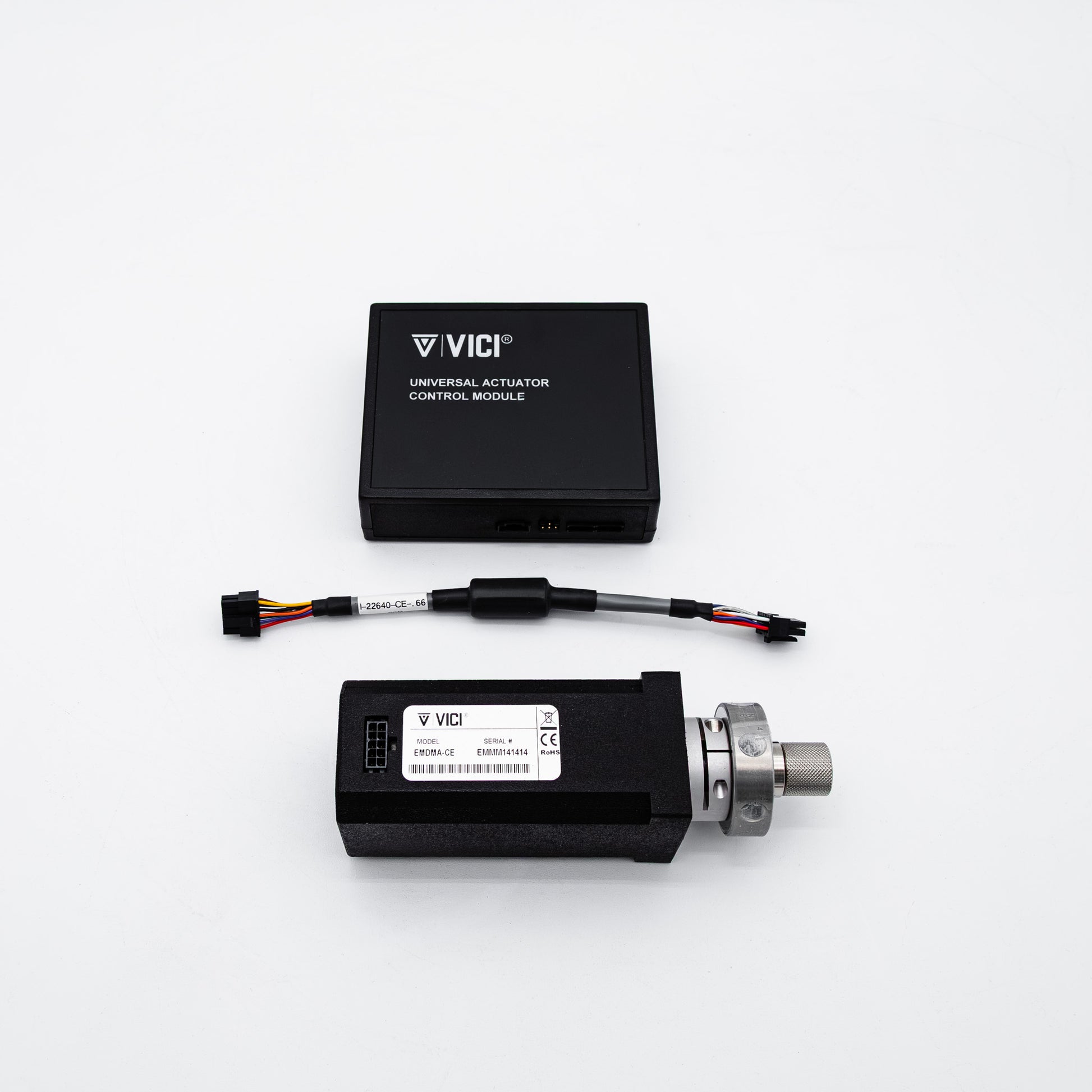 VICI universal positioning control module kit, featuring a black rectangular electronic module with a white label and a silver connector, alongside a black wire harness, on a clean white background.
