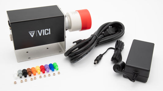 Black valve controller, AC power converter with cord and plastic connection pieces.